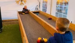 Kids of all ages will love to play carpet ball, foosball, and connect 4 while enjoying some complimentary hot fresh popcorn in our warmed game tent.